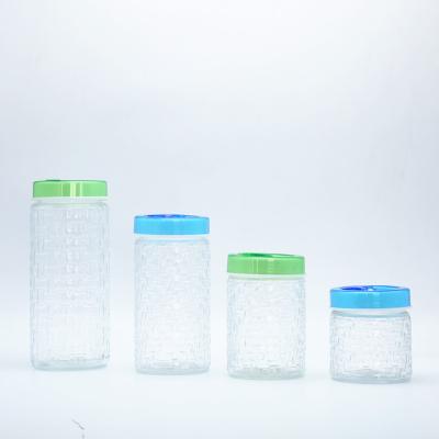 China 4 Piece Sustainable Vintage Clear Glass Storage Jars With Screw Lid Colored Plastic Glass Food Storage Jars for sale