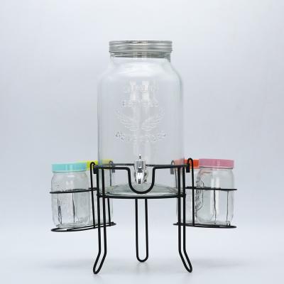 China 6 Liter Sustainable Clear Glass Bottle Dispenser With Tap And 4 Pieces Mason Jar In Metal Holder for sale