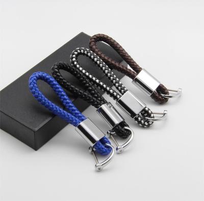 China Leather Simple anti-loss car key chain Metal buckle PU braided key lanyard PU custom color logo keychain for sale