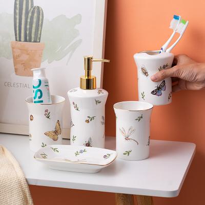 China Sustainable Luxury Ceramic Soap Dish Mouthwash Cups Lotion Bottle Toothbrush Cups Household Couples Hotel Bathroom Toiletries Sets for sale