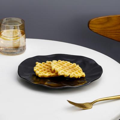 China Durable Black Ceramic Dessert Plate Salad Bowl Tableware Household Dish Irregular Porcelain Dish for sale