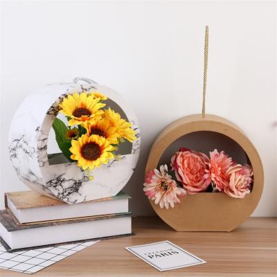 China Valentine's Day Recyclable Beautiful Hand Held Round Box Luxury Gift Box For Flowers for sale