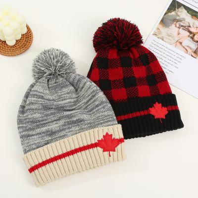 China European and American style embroidery Canada maple leaf beanie winter high quality adjustable knitted hats with yarn pom wool pom for unisex for sale