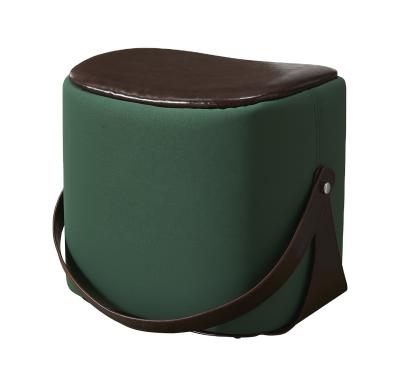 China Modern Home Elegant Saddle Barrel Stool Fabric Living Room Green Velvet Ottoman With Leather Belt for sale