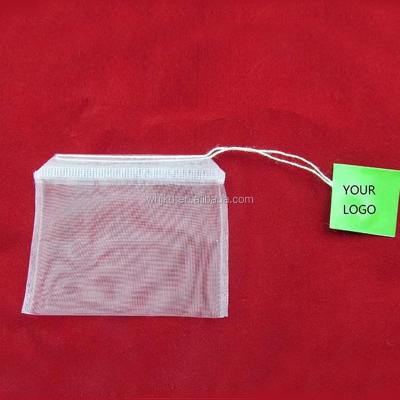 China Recyclable natural green biodegradable nylon empty tea bags with drawstring and tag for sale