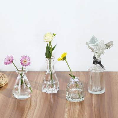 China Gift & Small Glass Craft Vase Flower Pot Basket Bottles Home Decoration Nordic Deco Dried Flower Hydroponic Transparent Small Bottle for sale