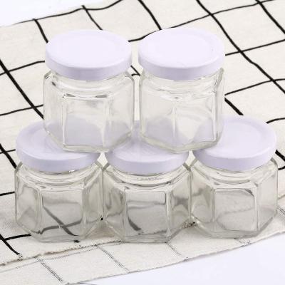 China Small Mason Jars Mini Honey Jars 45/60/180ml Food Clear Hexagon Jars With Lids for sale