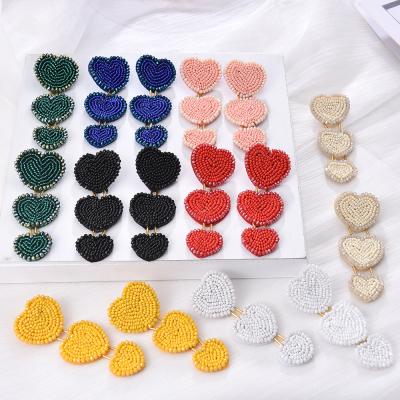 China European and American fashion cute soft love rice pearl earrings hand - to the heart woven earrings the new trend for sale