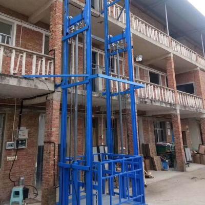 China Construction material stores 1000kgs guide rail cargo lift for work shoop or warehouse for sale