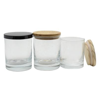 China Fashionable Wholesale Clear Thick Wall Empty Glass Candle Jars Jars With Wooden Lids For Candle Making for sale