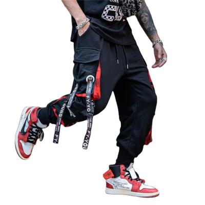 China Custom Viable Cargo Jogging Pants Blocks Color Pocket Sports Mens Pants Street Pack Letter Ribbon Leisure for sale