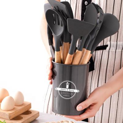 China Viable 12pcs Wooden Logo Custom Multifunctional Silicone Kitchen Utensils Handle Non Stick Pot Baking Cooking Spoon Brush Silicone Sets for sale