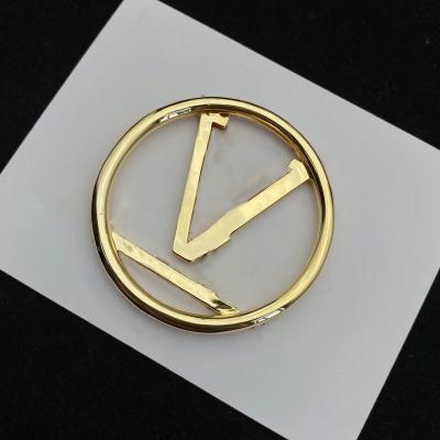 China Stainless steel Fashion brand 18K gold classic V letter shirt accessories brooch vintage luxury brooch for sale