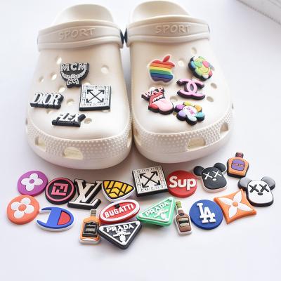 China 2022 Sounds Eco-Friendly Logo Famous Brand Pvc Shoe Car Charms Clog Charms For Wristband And Shoes Croc Charm for sale