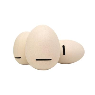 China Factory Direct Eco-friendly Custom Shaped Ceramic Egg Shape Decorative Money Bank Money Box For Kids for sale