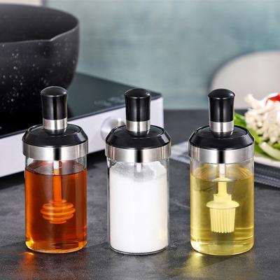 China Viable Clear Salt Bottle Glass Seasoning Shaker Bottle Jam Spice Jar Container With Spoon Brush for sale