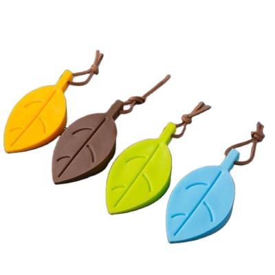 China Hot Selling Durable Silicone Wedge Door Stop Safety Child Door Stopper Creative Multicolor Cute Leaf Door Stopper for sale