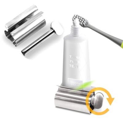 China Stainless Steel Rotate Toothpaste Stand Holder Toothpaste Tube Roller Squeezer Dispenser for Bathroom for sale