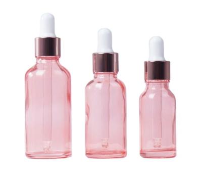 China Fashion Luxury Pink Glass Bottle Rose Gold Essential Oil Hair Oil Dropper Bottles New Product 10ml 30ml 50ml 100ml for sale