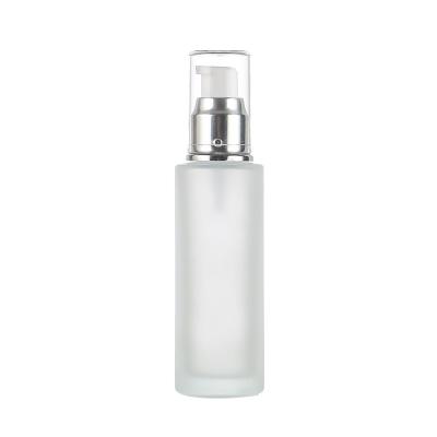 China 50ml 100ml Cosmetic Wholesale Flat Shoulder Frosted Glass Travel Lotion Bottle With Gold Cap for sale