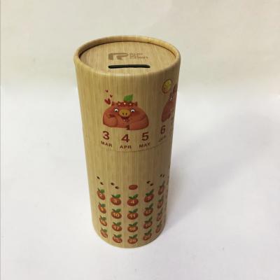 China Custom Logo Coin Bank Diameter 85mm Kraft Paper Push Up Tube for sale