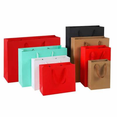 China Recycled Materials Wholesale Custom Printed Gift Paper Shopping Bag With Handle for sale