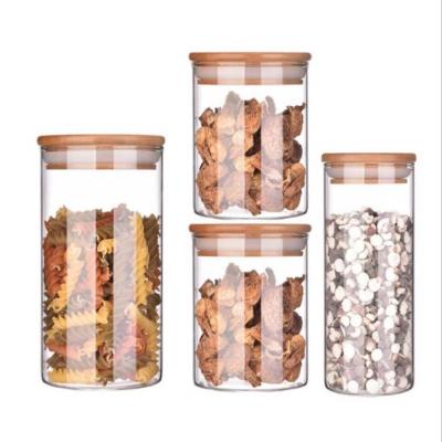 China Sustainable Borosilicate Glass Storage Jar With Bamboo Lid For Tube Shaped Storage Glass Jar For Spice Glass Jar With Wooden Lid for sale