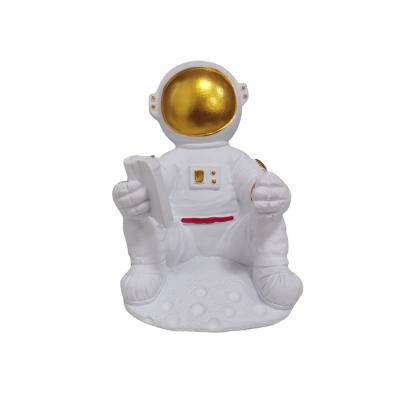 China ZC Astronaut Resin Viable Ornaments Bathroom Sets Hanger With Hook Storage Shelf Toothbrush Holder Electric Toothbrush Holder for sale