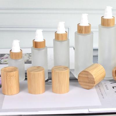 China 30ml 50ml 60ml 80ml 100ml 120ml Fashionable Frosting Glass Cream Bottle Spray Cosmetic Packaging Bottle With Wooden Lid for sale