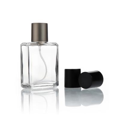 China Factory Wholesale 30ml 50ml 100ml Cylinder Perfume Glass Cosmetic High End Bottle With Zamac Lid for sale