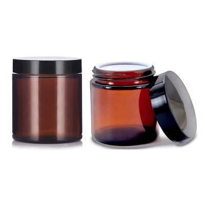 China 100ml 250ml Amber Round Glass Empty Cosmetic Candle Jar Cream Bulk Jar With Matt Black Lid for sale