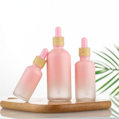 China Wholesale Cosmetic Luxury Pink Glass Dropper Bottle 15ml 30ml 50ml 100ml Essential Oil Bottles Lotion Packaging Bottle for sale