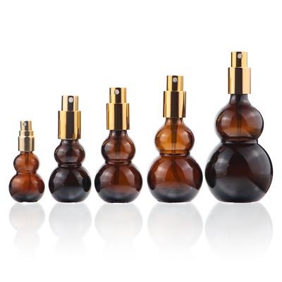 China 15ml cosmetic 30ml 50ml 100ml 120ml Amber Double Gourd Shape Cosmetic colored glass dropper bottle with box for sale