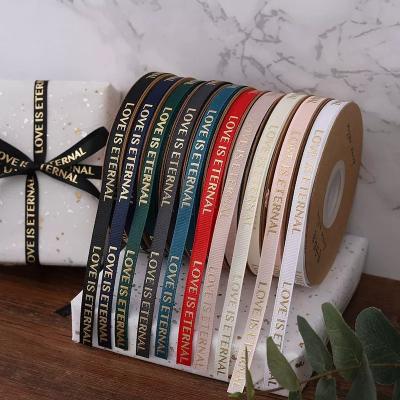 China Customized Viable Luxury Logo Grosgrain Ribbon For Gift Wrapping Relief Printing Polyester for sale