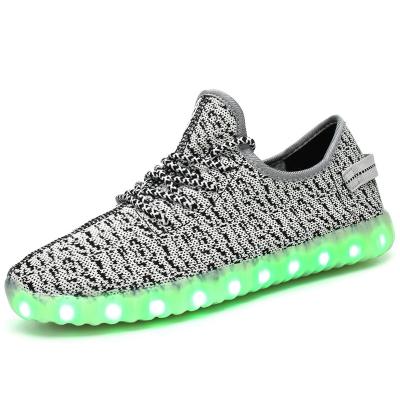 China Fashion trend led lighting couples men and women sports shoes usb charging students flying woven lightweight shoes for sale