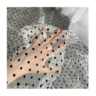 China Sustainable High quality nylon mesh flocking polka dot black sexy dress fabric for sale