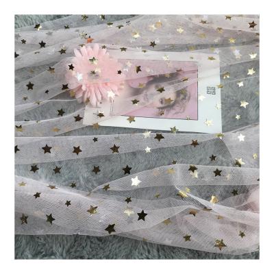 China Breathable Manufacturer Wholesale Luxury Lightweight Mesh Nylon Tulle Gilding film stars Lace Fabric Clothing for sale