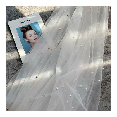 China QUICK-DRY Nylon mesh beaded pearl table flag fabric custom bridal fabric textile raw materials for sale