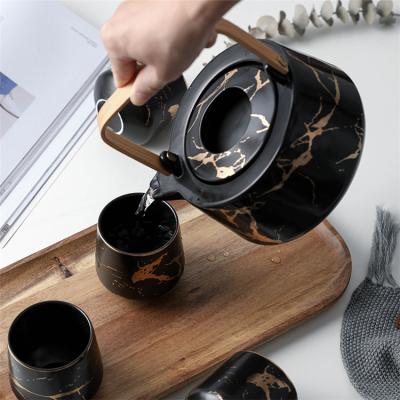 China Restaurant Sustainable Luxury Marble Gold Black Gold Ceramic Teaware Tea Set With Bamboo Tray for sale