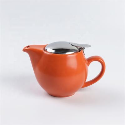 China Sustainable Western Style Glossy Orange Cheap Custom Logo Ceramic Teapot With Strainer for sale