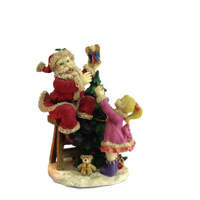 China Holiday Hot selling resin art gifts gifts Christmas theme Santa Claus and little girl scene home decorations for sale