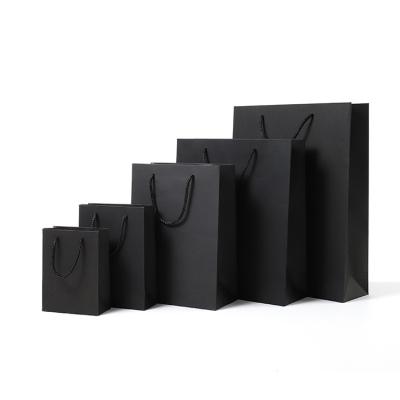 China Recycled Materials Wholesale Luxury Black Shoes Clothes Kraft Paper Bags Printed Logo Custom Packaging Paper Bag Clothing Shopping Gift Jewelry for sale