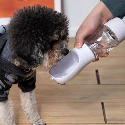 China Viable Drop Shipping Pet Travel Multifunctional Water 200g Food Driver Dog Water Bottle Plastic Portable Water Bottle 330ml for sale