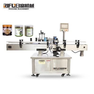 China automatic food jam jars labeling machine/eyedrop round bottle automobile labeling machine tomato sauce round bottle labeler machine for sale