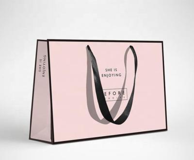 China Handmade Custom Paper Gift Bags Luxury Pink Paper Shopping Bags for sale