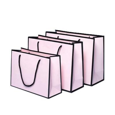 China Recyclable Pink Color Luxury Paper Bags Custom Paper Shopping Bags for sale