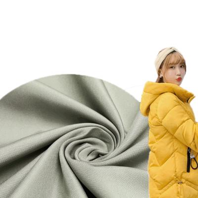 China Memory 2021 New Arrivals 75D Polyester 18*3*34 Yard Dyed Super Soft 100% Peach Skin Woven Fabric For Down Coat Lining for sale