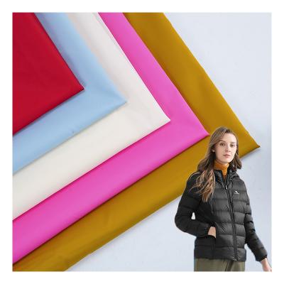 China Waterproof 360T Ripstop 30D High End Plain Dyed Waterproof Stock Down Jacket Coat 100% Nylon Taffeta Fabric for sale
