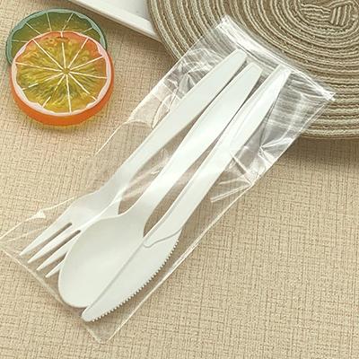 China Eco-Friendly Disposable PLA Knife Fork Spoon 100% Biodegradable Plastic Cutlery Set With Napkin for sale