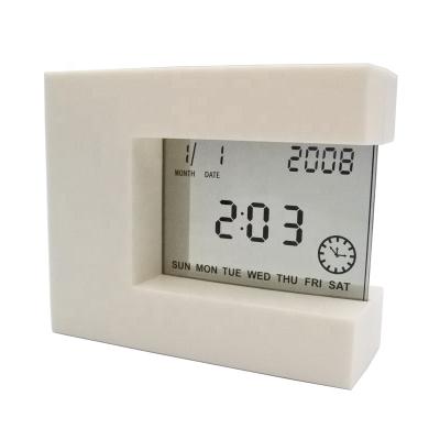 China Time Use+ Date+Temperature Countdown Side Temperature Alarm Clock Calendar Rotating Electronic Induction Clock for sale